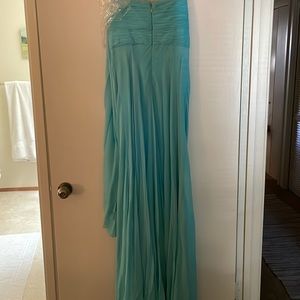 Beautiful turquoise evening gown with detachable self scarf.
